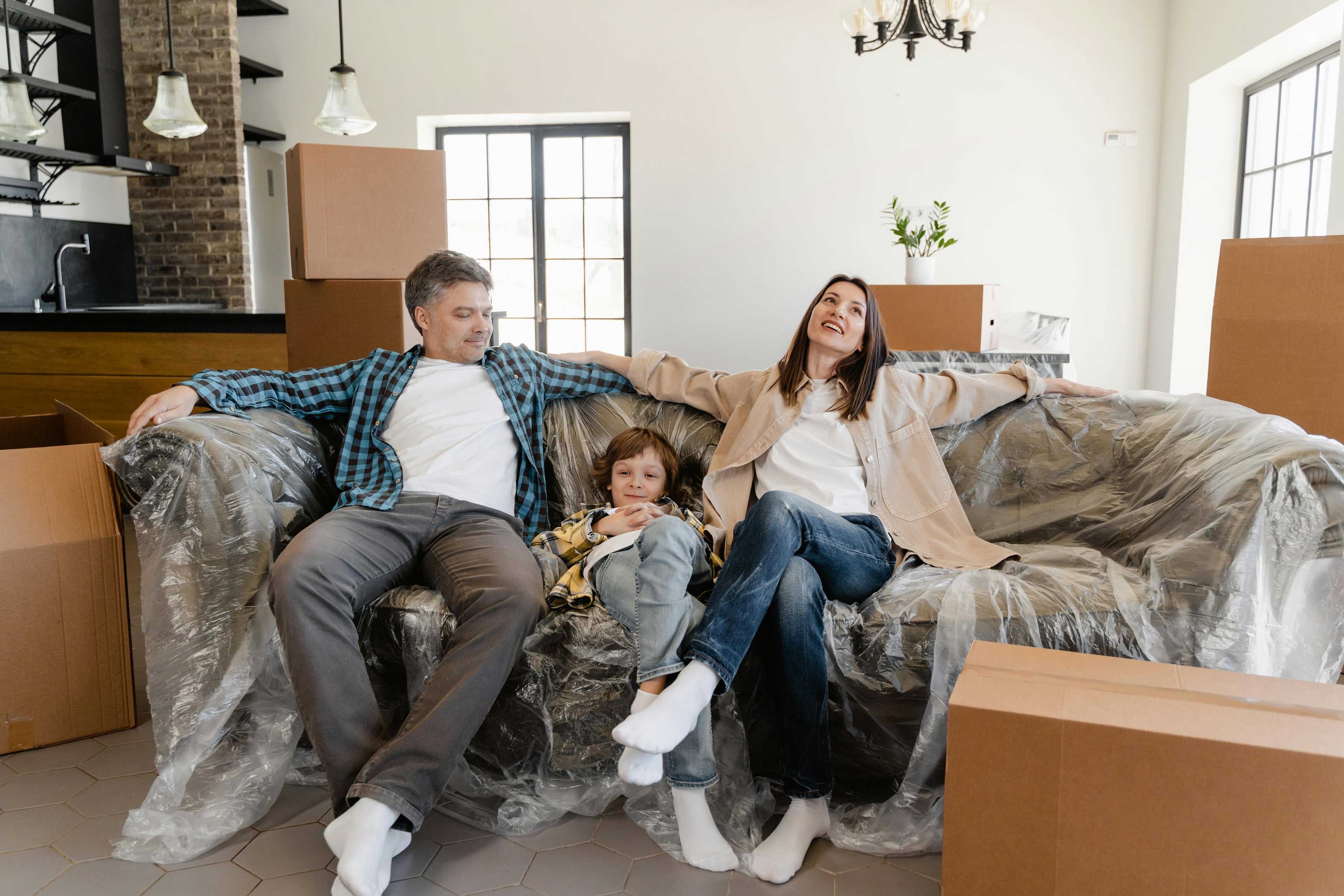 A happy family settling into their bright new home on moving day