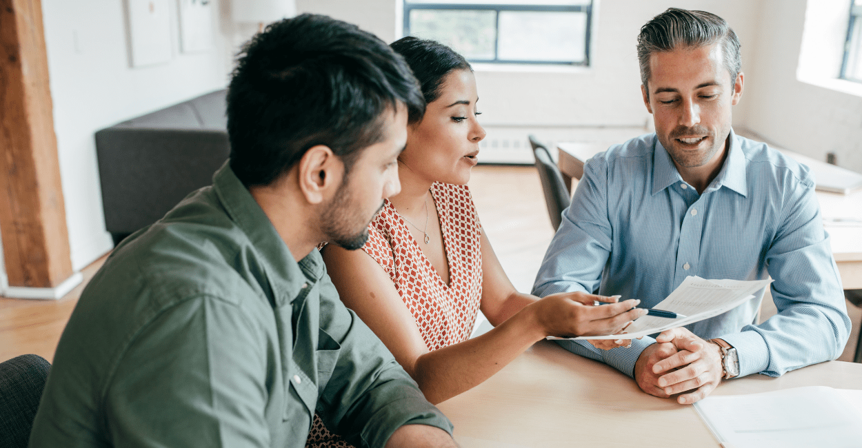 Couple discussing mortgage rates with their loan officer.